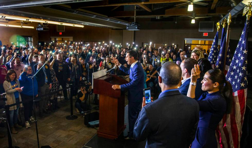 Members of the crowd hold up their lit phones in support as Democratic presidential candidate a ...