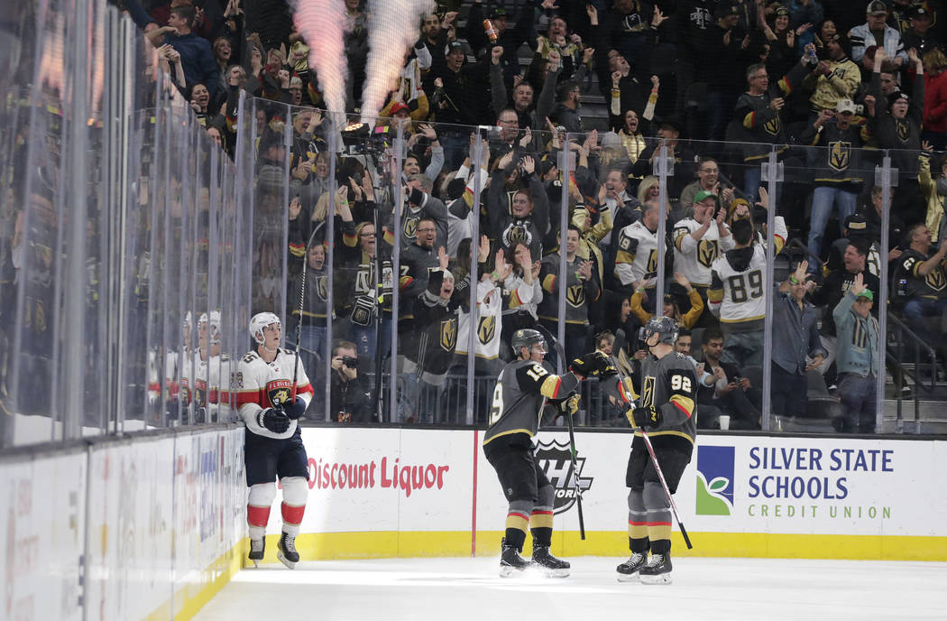 Vegas Golden Knights right wing Reilly Smith (19) celebrates with left wing Tomas Nosek (92) af ...