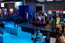 Scientific Games showcases their new games and technology behind a wall surrounding the booth t ...