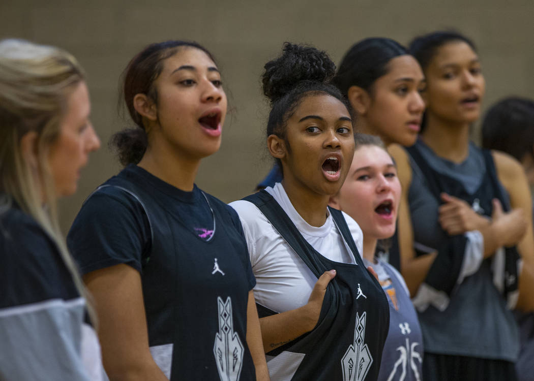 Desert Oasis girl's basketball team players yell out the next play to those on court during pra ...