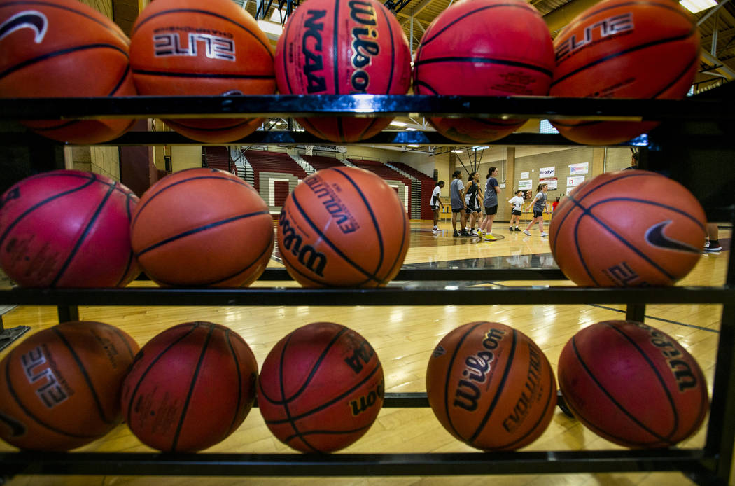 The Desert Oasis girl's basketball team players on the court during practice under head coach L ...