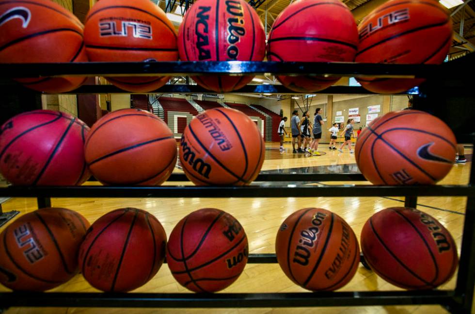 The Desert Oasis girl's basketball team players on the court during practice under head coach L ...