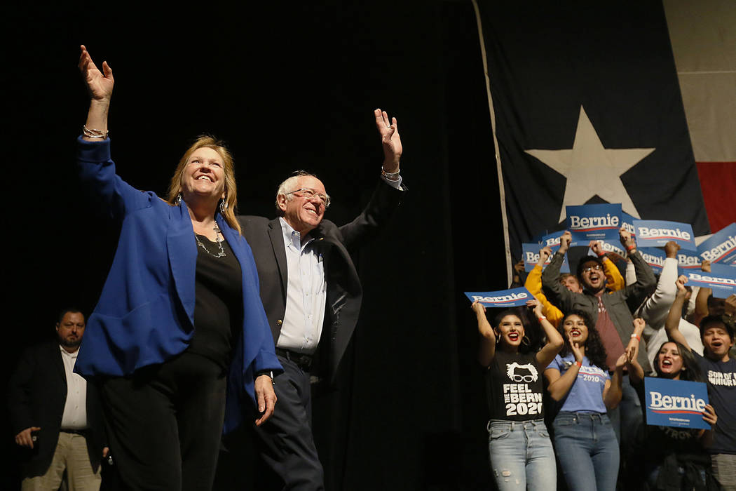 Democratic presidential candidate Sen. Bernie Sanders I-Vt. takes the stage with his wife Jane ...