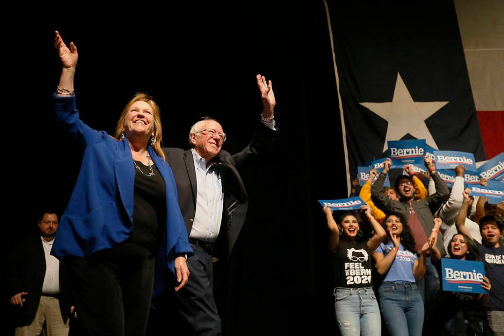 Democratic presidential candidate Sen. Bernie Sanders I-Vt. takes the stage with his wife Jane ...