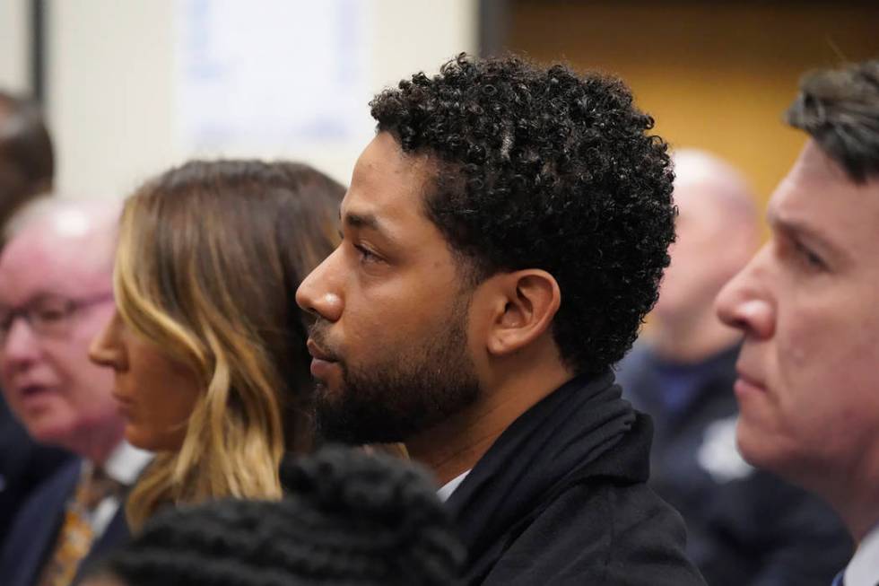 Actor Jussie Smollett, center, appears in a courtroom at the Leighton Criminal Court Building i ...