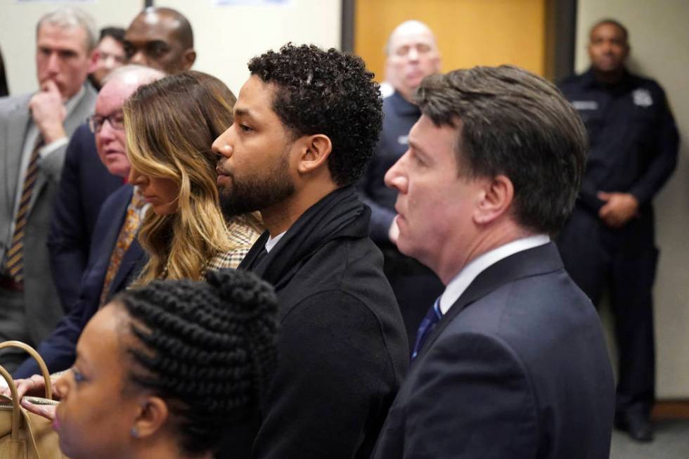 Actor Jussie Smollett, center, appears in a courtroom at the Leighton Criminal Court Building i ...