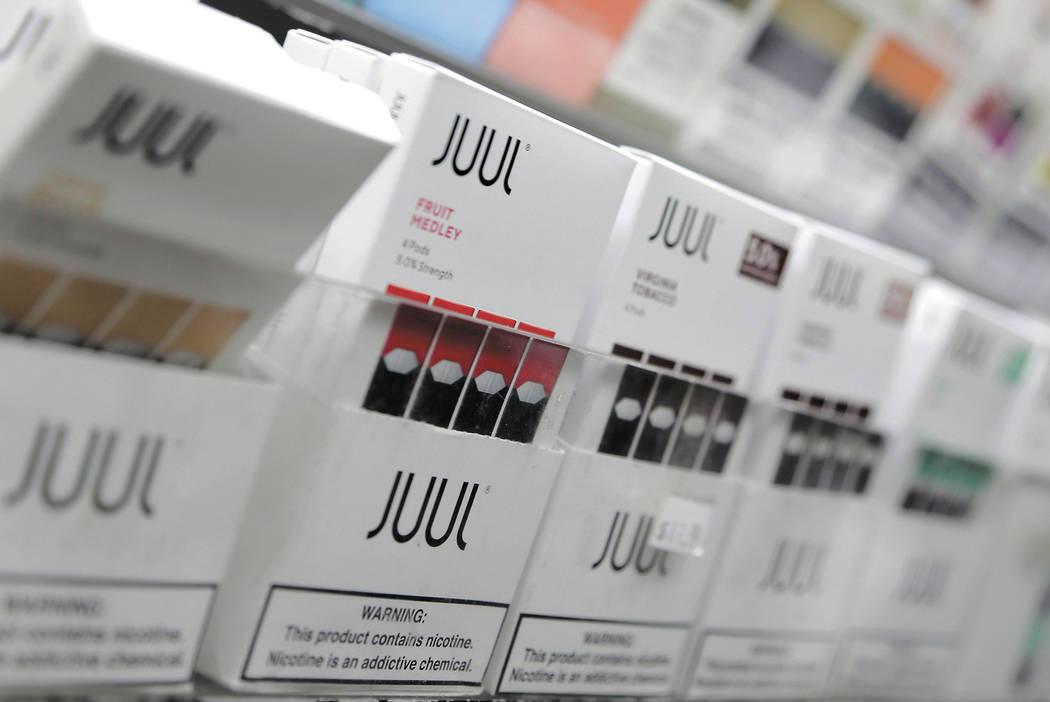 FILE - In this Dec. 20, 2018, file photo, Juul products are displayed at a smoke shop in New Yo ...