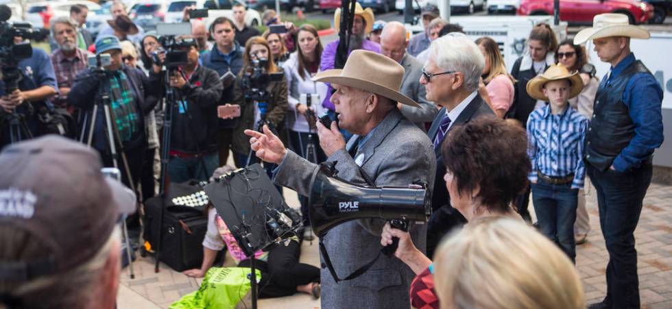 Rancher Cliven Bundy, center, addresses supporters and journalists at Las Vegas Metropolitan Po ...