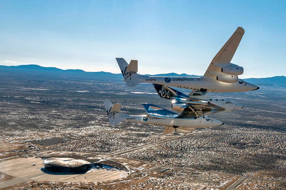 This photo provided by Virgin Galactic shows the Virgin Galactic's VSS Unity flying over Spacep ...