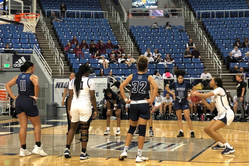 Centennial guard Taylor Bigby shoots a free throw during the fourth quarter of a 62-37 victory ...