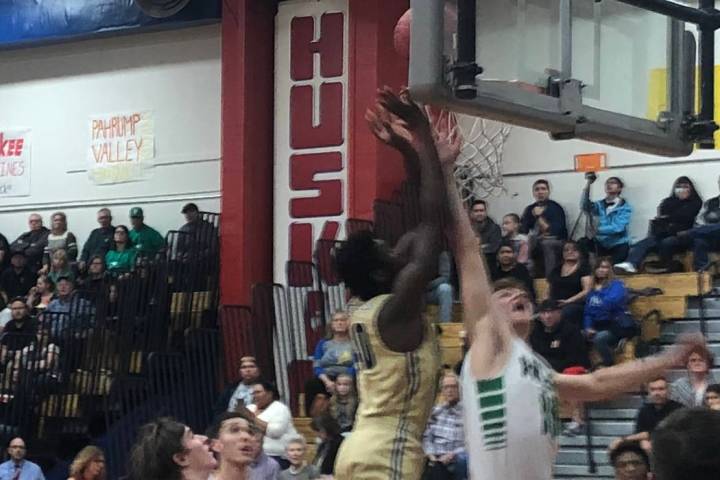 Boulder City's Jacob Sanford shoots over a Churchill County defender in the Eagles' 67-57 loss ...