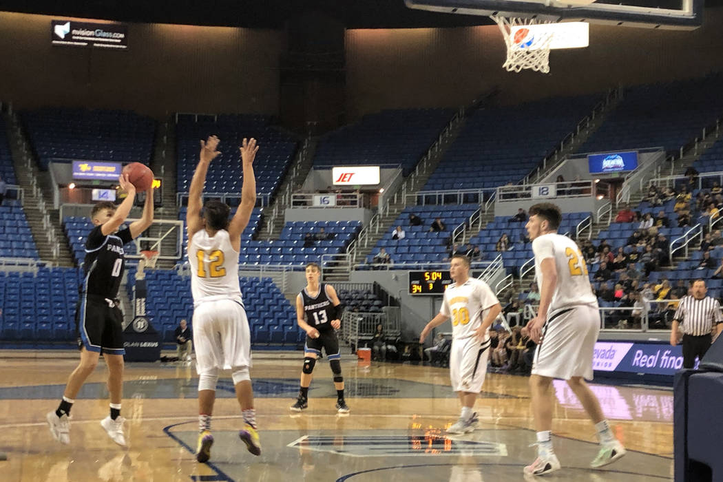 Pahranagat Valley senior guard Preston Higbee shoots a jumper in the third quarter of a 50-38 l ...