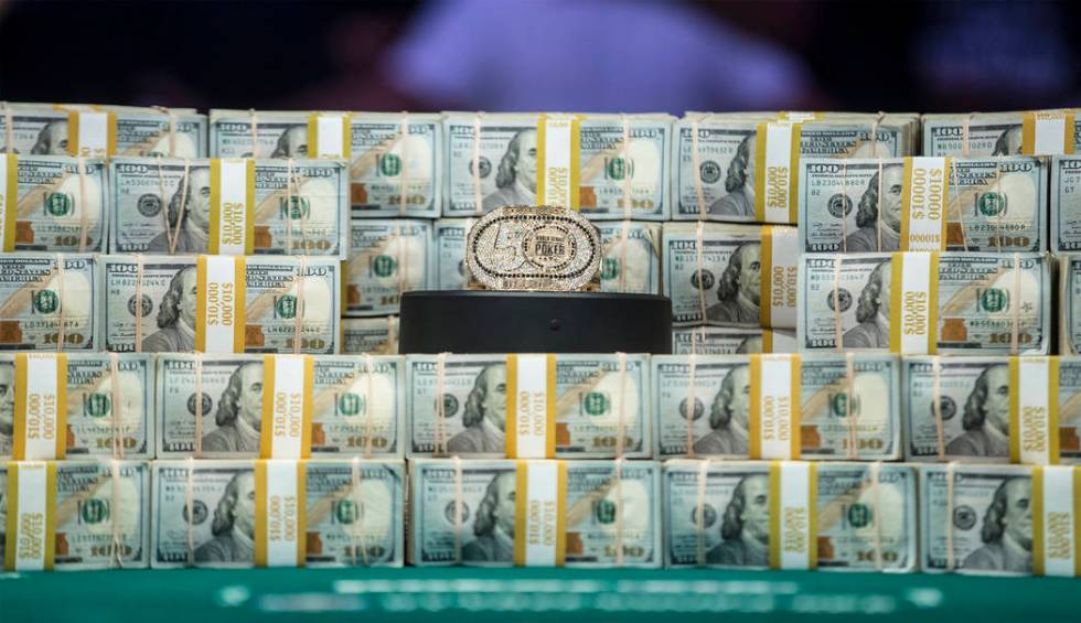Stacks of cash are displayed on the table during the World Series of Poker Main Event on Tuesda ...