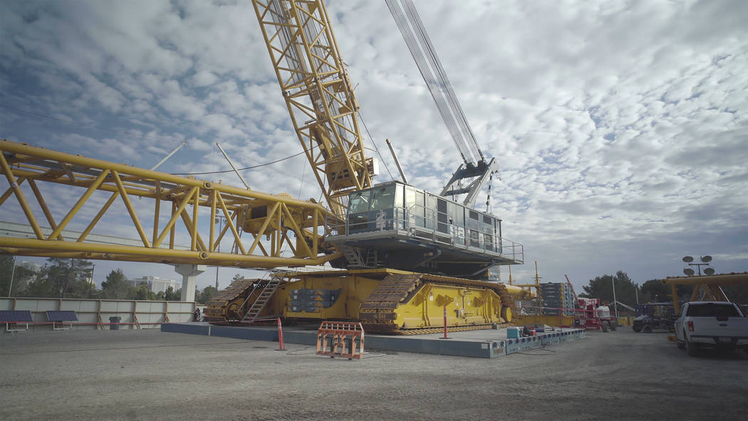 Weighing 869 tons, the DEMAG CC-8800 sits on top of specially designed steel mats because the g ...