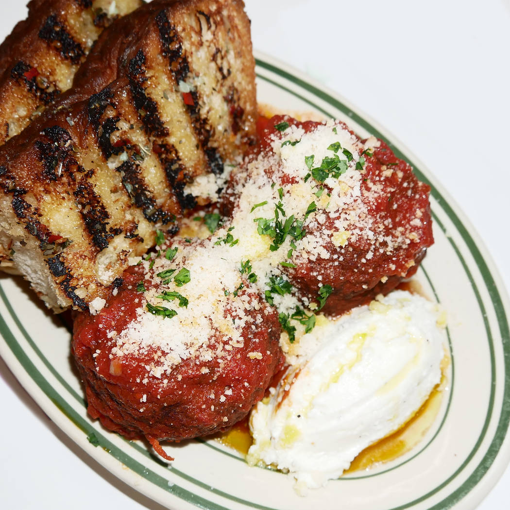 Marinara-braised meatballs with ricotta and garlic bread. (Erica Gould)