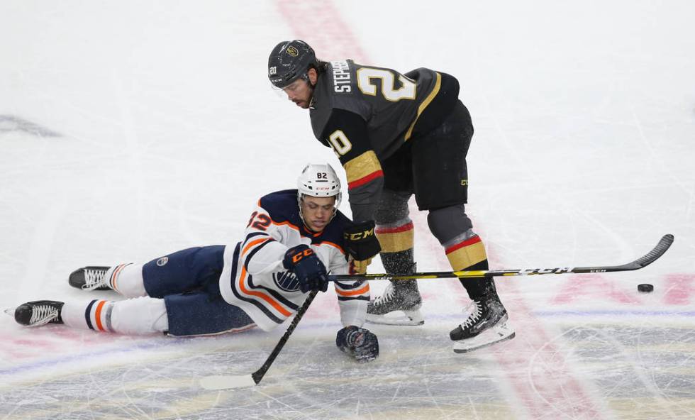 Vegas Golden Knights center Chandler Stephenson (20) collides with Edmonton Oilers defenseman C ...