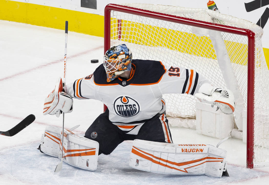 Edmonton Oilers goaltender Mikko Koskinen (19) makes a save in the second period of an NHL hock ...