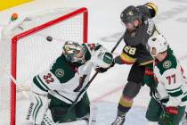 Vegas Golden Knights left wing William Carrier (28) assists on a goal against Minnesota Wild go ...
