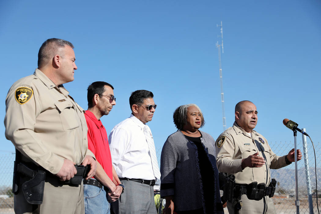 From left, Metropolitan Police Department Lt. Mark Lourenco, outreach specialist at US VETS Las ...