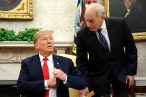 White House Chief of Staff John Kelly, right, leans in to talk with President Donald Trump duri ...