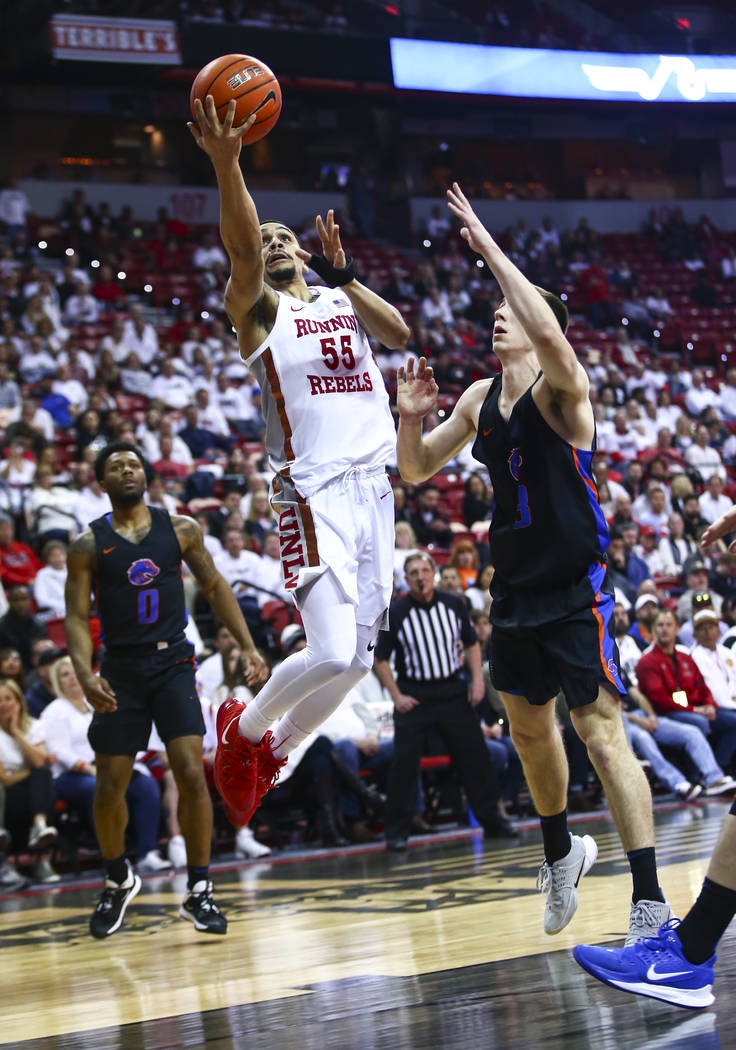 UNLV Rebels' Elijah Mitrou-Long (55) goes to the basket against Boise State Broncos' Justinian ...