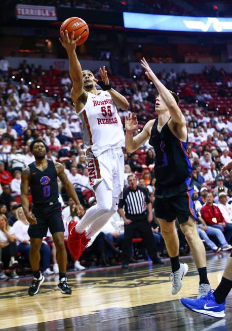 UNLV Rebels' Elijah Mitrou-Long (55) goes to the basket against Boise State Broncos' Justinian ...