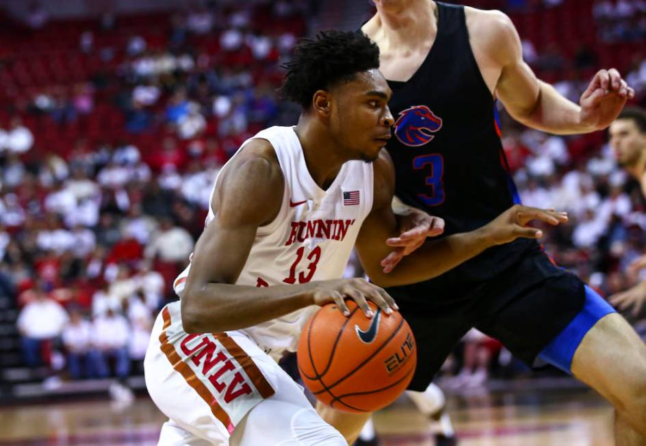 UNLV Rebels' Bryce Hamilton (13) drives to the basket against Boise State Broncos' Justinian Je ...