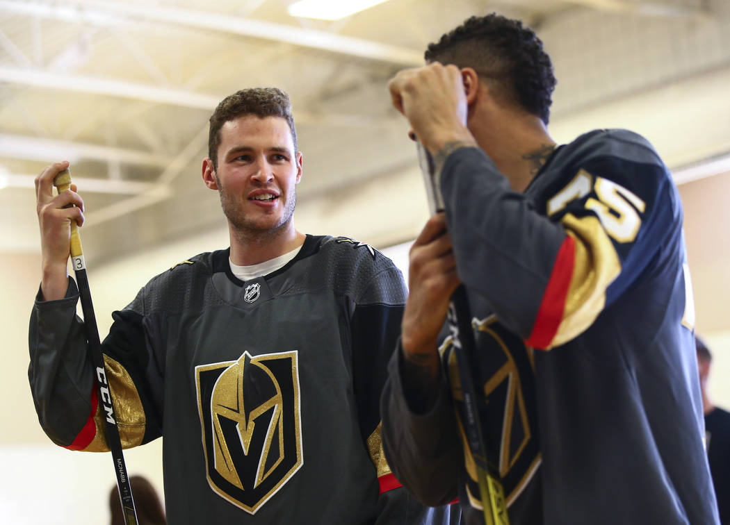 Golden Knights defenseman Brayden McNabb, left, and forward Ryan Reaves participate in a youth ...