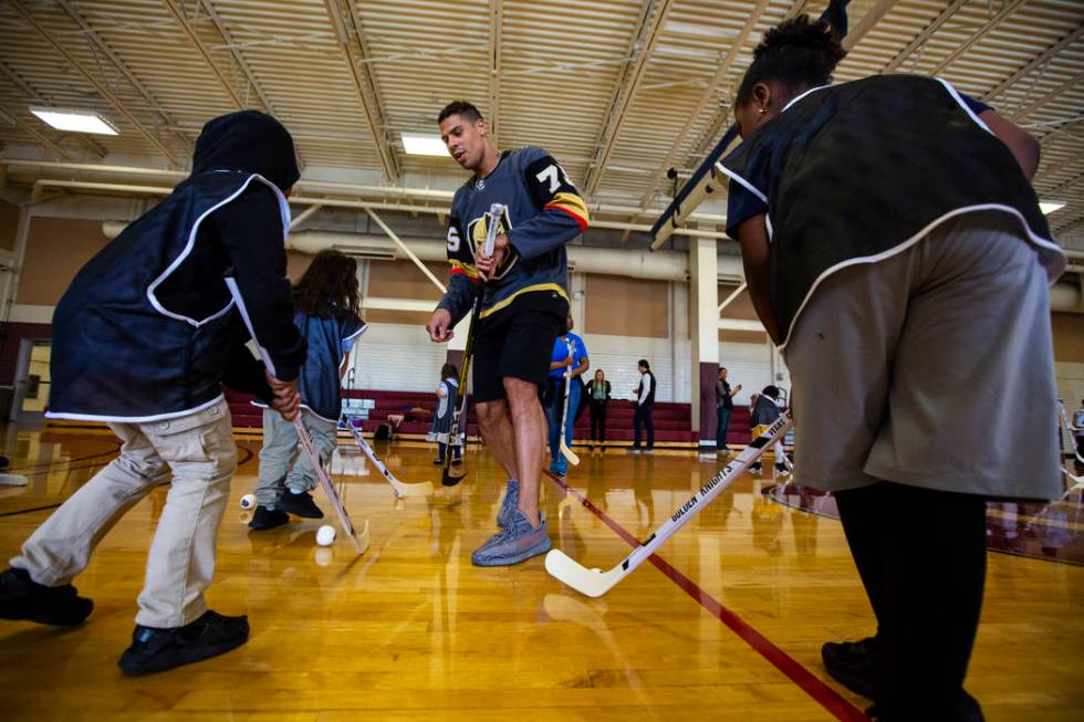 Golden Knights forward Ryan Reaves helps lead a youth street hockey clinic at Doolittle Recreat ...