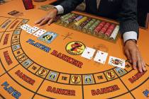 Cards are shown during a demonstration of play at an EZ Baccarat table at Palace Station on Wed ...