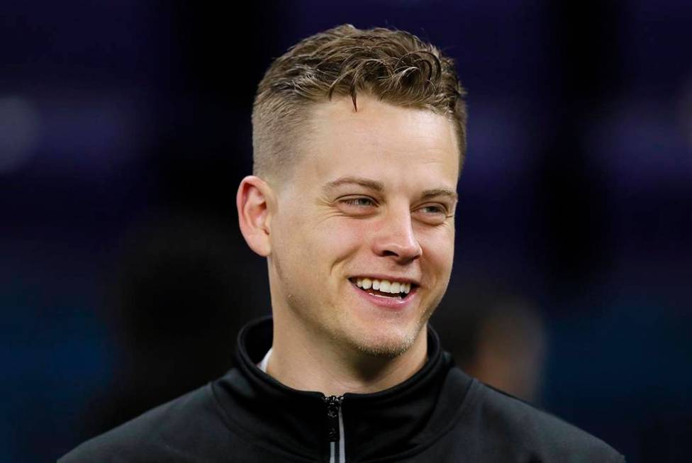 LSU quarterback Joe Burrow watches a drill at the NFL football scouting combine in Indianapolis ...