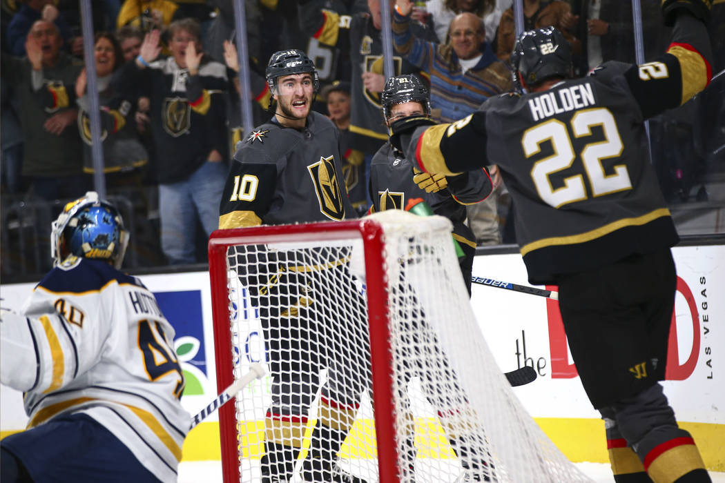 Golden Knights' Nic Roy (10) celebrates his goal against the Buffalo Sabres with teammates duri ...