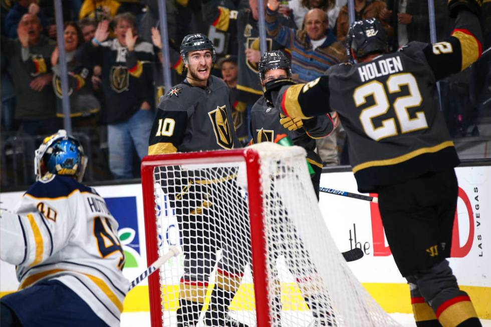Golden Knights' Nic Roy (10) celebrates his goal against the Buffalo Sabres with teammates duri ...