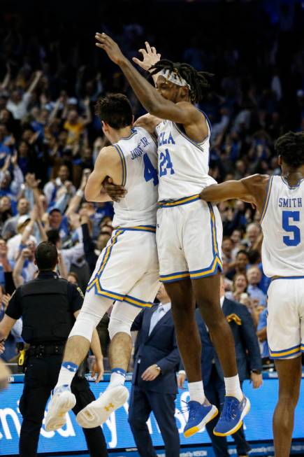 UCLA guard Jaime Jaquez Jr. (4) and UCLA forward Jalen Hill (24) celebrate after the team's win ...