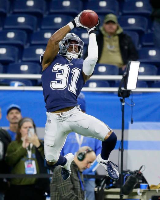 Dallas Cowboys cornerback Byron Jones catches during pregame of an NFL football game against th ...