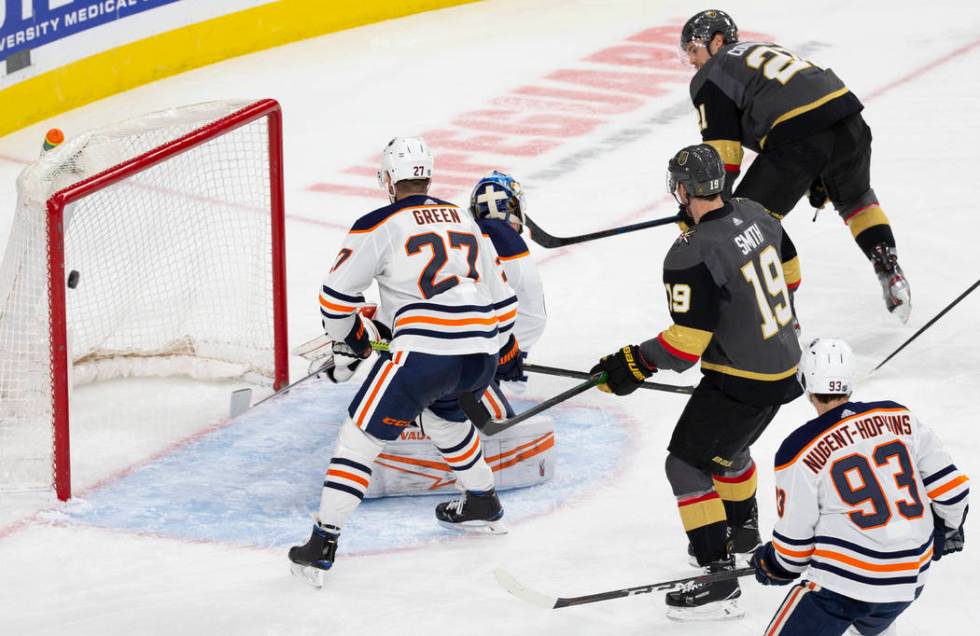 Vegas Golden Knights center Nick Cousins (21) scores against Edmonton Oilers goaltender Mikko K ...