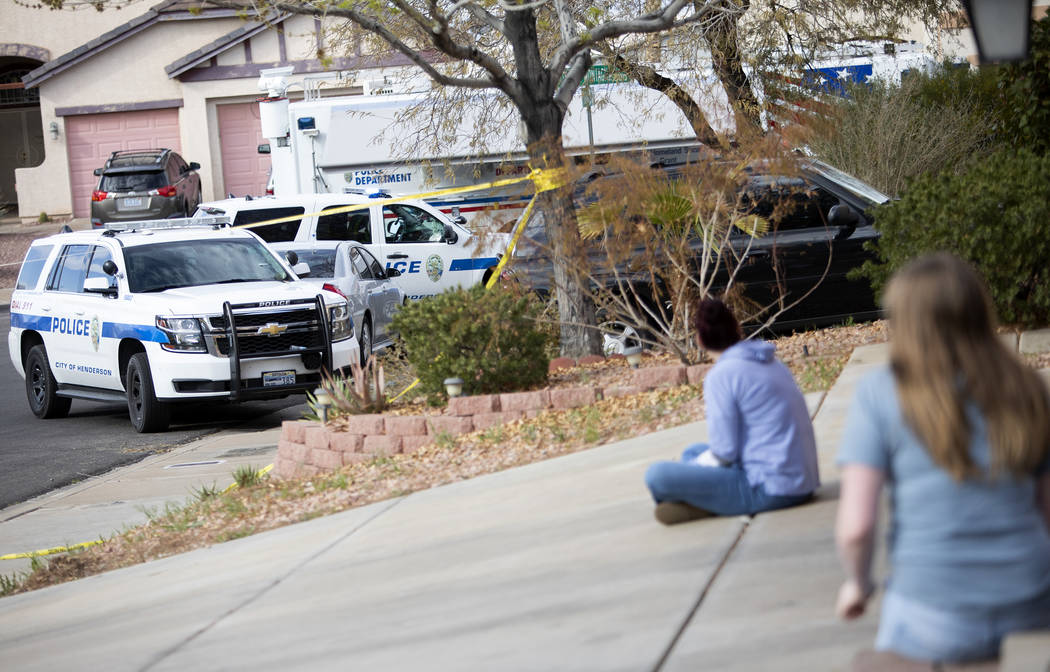 Neighbors watch officers work an "officer-involved" shooting occurred near Cabana Bla ...