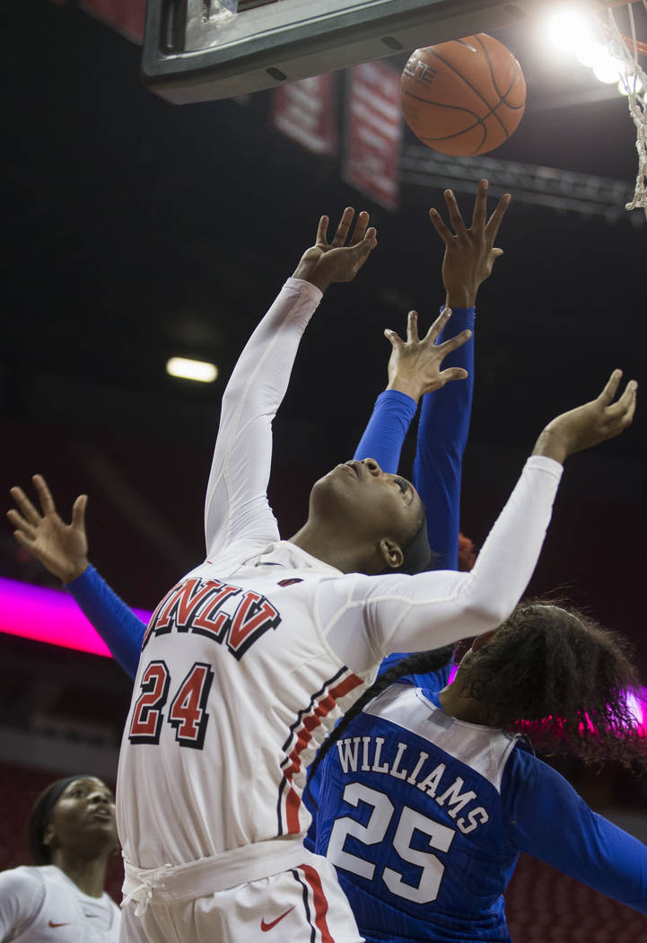 UNLV Lady Rebels guard Rodjanae Wade (24) fights for a rebound with Duke Blue Devils forward Ja ...