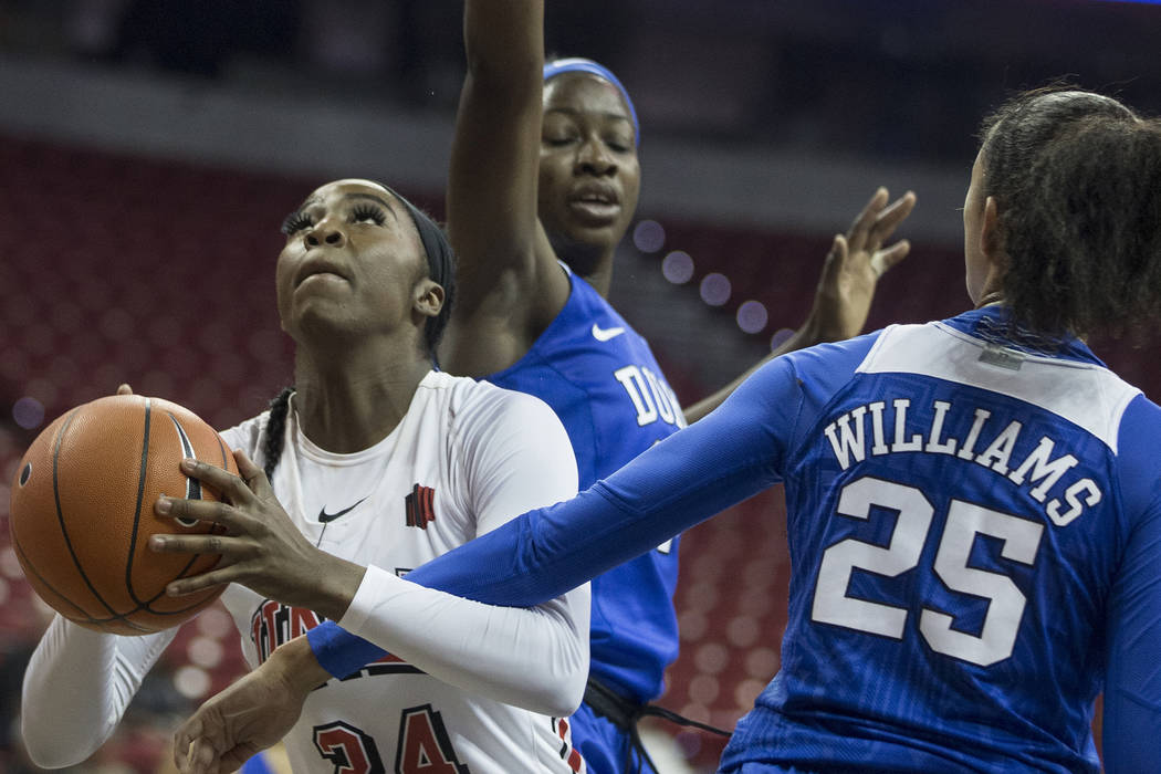 UNLV Lady Rebels guard Rodjanae Wade (24) slices past Duke Blue Devils forward Jade Williams ( ...