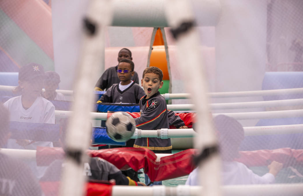 Maddox Bryan, 6, reacts to a kicked ball during an inflatable soccer game during the Vegas Gold ...