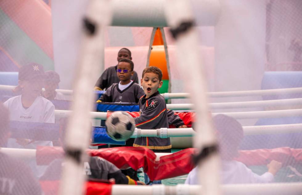 Maddox Bryan, 6, reacts to a kicked ball during an inflatable soccer game during the Vegas Gold ...