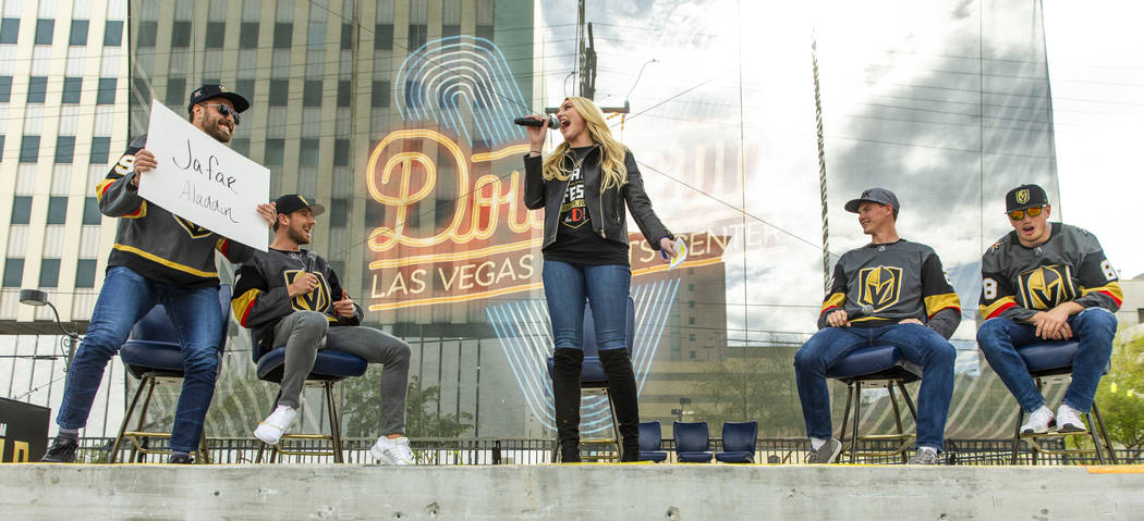 Vegas Golden Knights rinkside reporter/host Stormy Buonantony, center, moderates as players enj ...