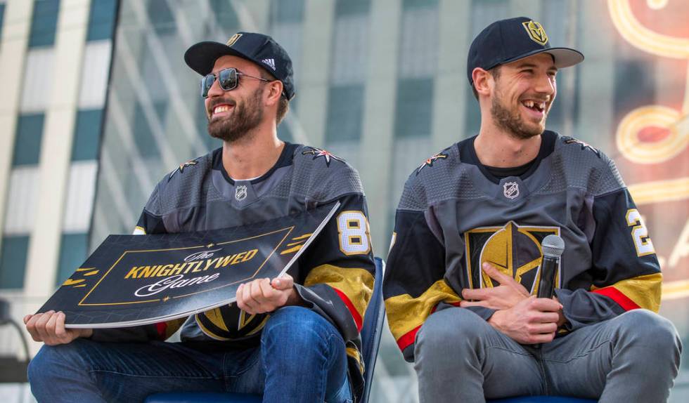 Vegas Golden Knights players Alex Tuch, left, and Shea Theodore laugh as they play a round of T ...