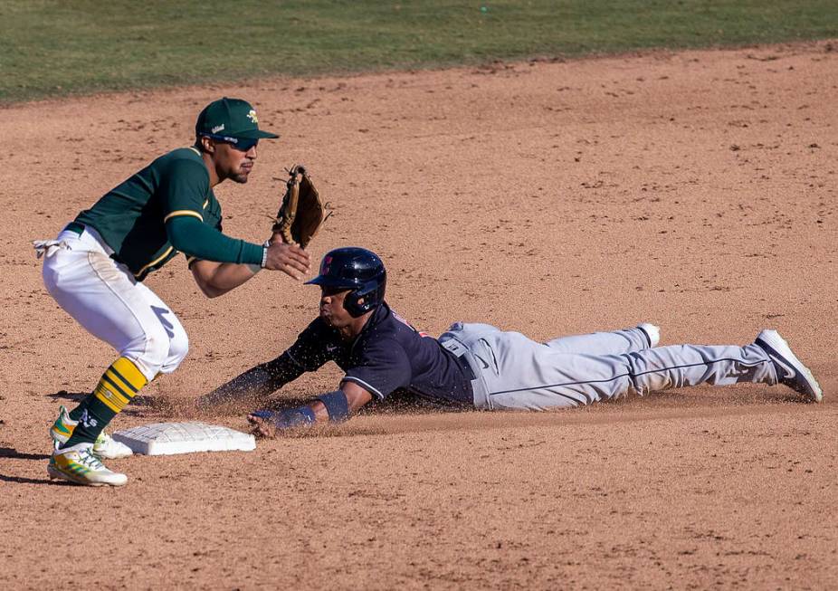 Cleveland Indians right fielder Greg Allen (1) slides safely under the tag of Oakland Athletics ...