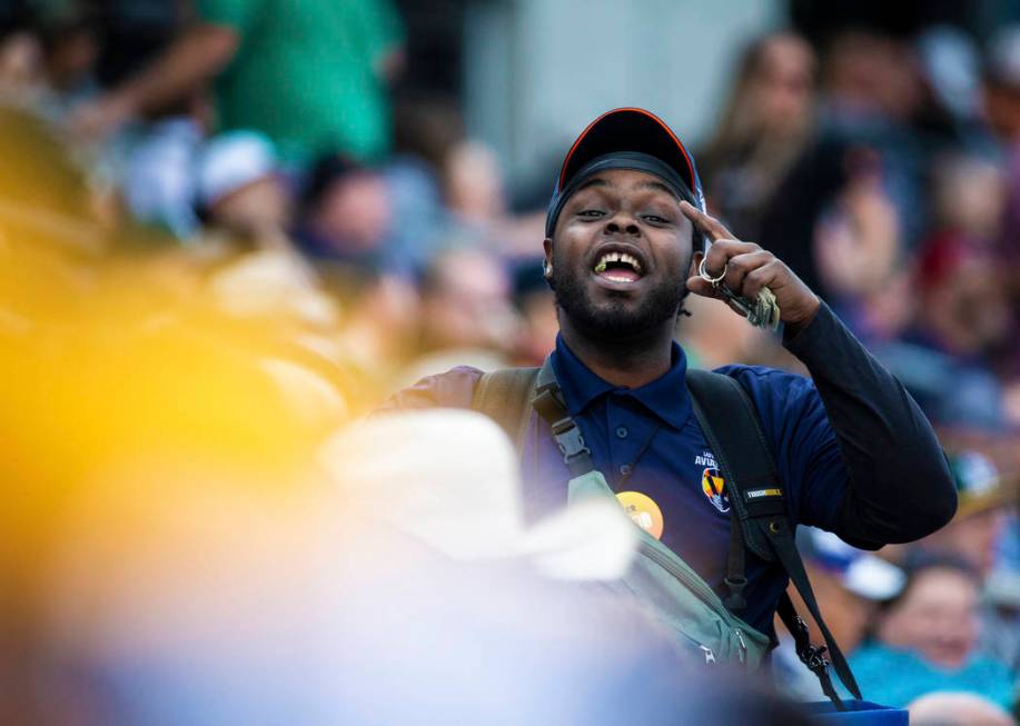 A beer vendor takes orders along the right field line in the third inning during a Major League ...