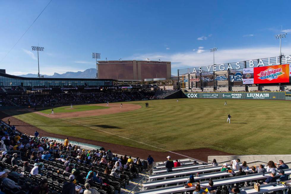 The Cleveland Indians and Oakland Athletics warm up during a Major League Baseball game at Big ...