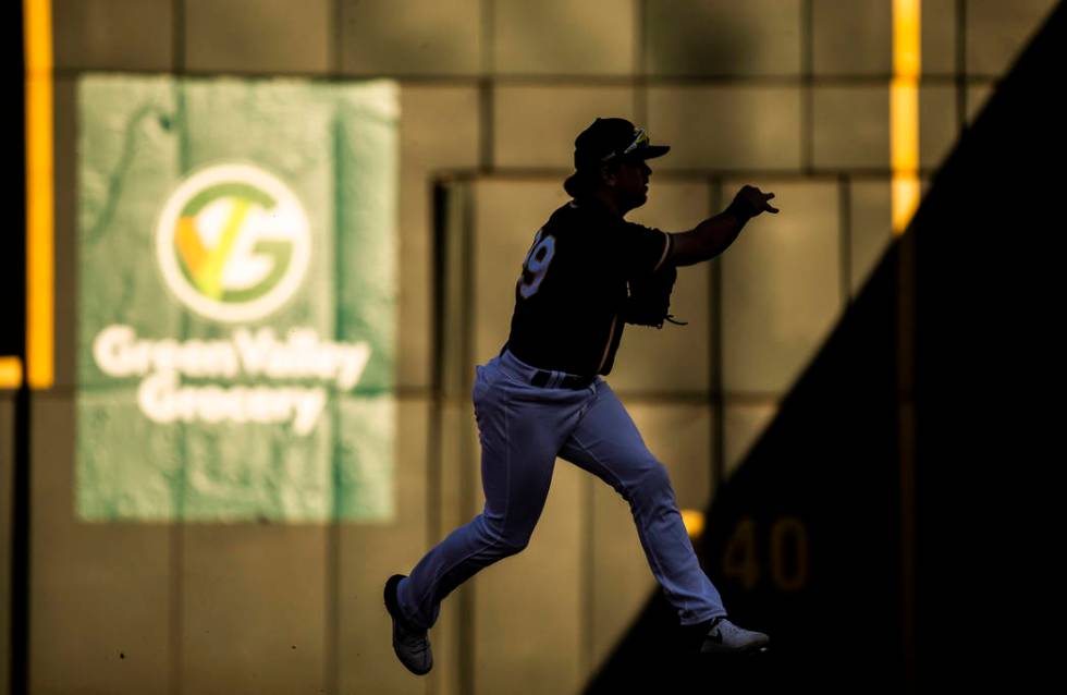 Oakland Athletics second baseman Trace Loehr (99) makes a leaping throw in the ninth inning dur ...