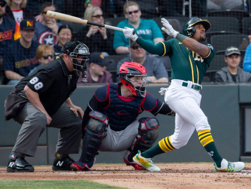 Oakland Athletics second baseman Tony Kemp (5) drives a ball to right field in the second innin ...