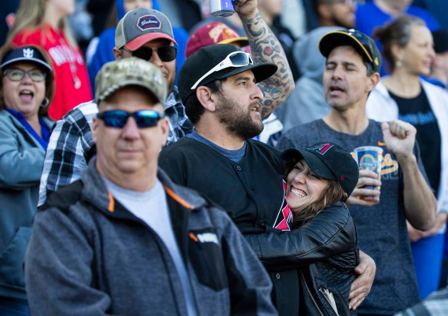 Fans sing "Take Me Out to the Ball Game" during the seventh inning stretch of a Major ...