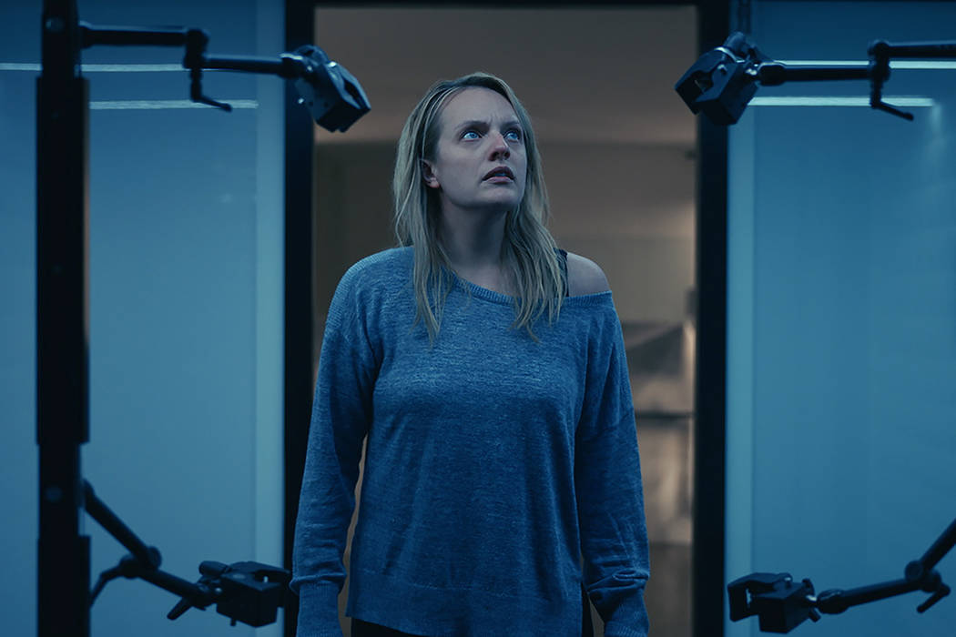 This image released by Universal Pictures shows Elisabeth Moss in a scene from "The Invisi ...